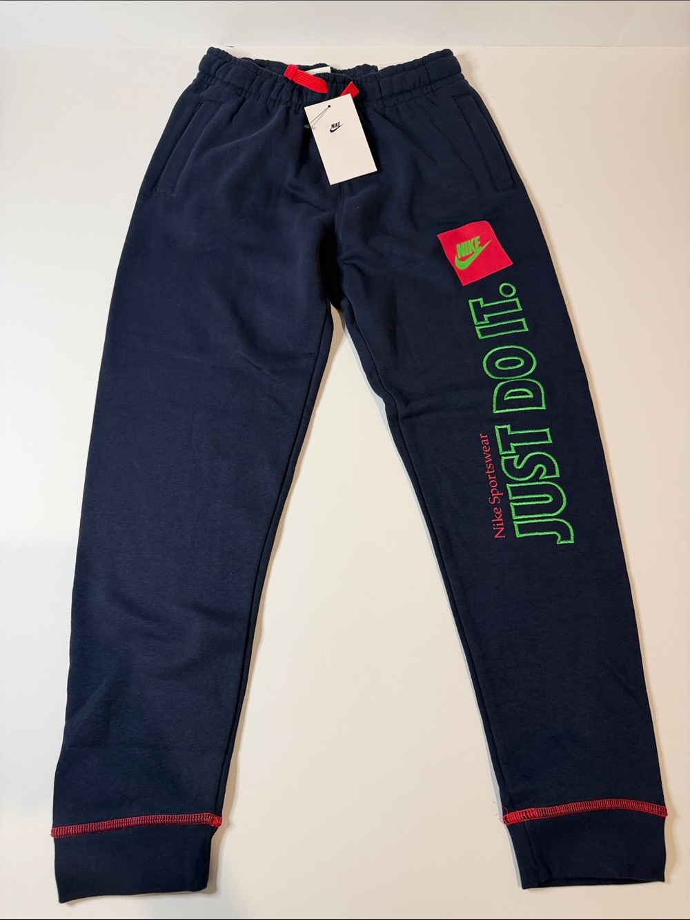 Nike Kids Navy Sweatpants with Neon Green & Red Accents